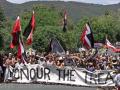Protest march with Māori flags and Honour the Treaty banner