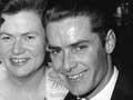 Smiling couple dressed in formal clothing