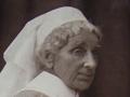 Seated woman in nurses uniform