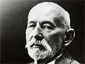 Frederic Williams in later life; bald, moustatchioed, well-dressed.