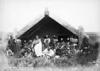 Māori outside a meeting house at Waipahihi, with Te Rangitāhau standing at the front