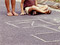 Hop scotch grid with kids feet